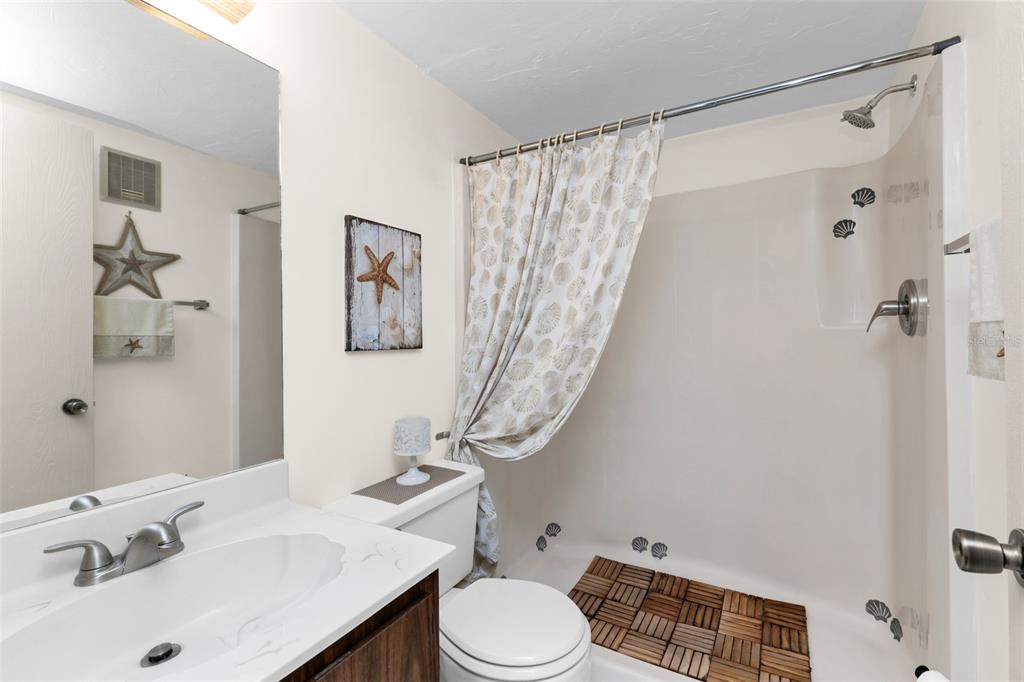 25225 Rampart Boulevard, Unit 1604 Punta Gorda, FL 33983 - Photo 19 of 41 a bathroom with a sink toilet and shower