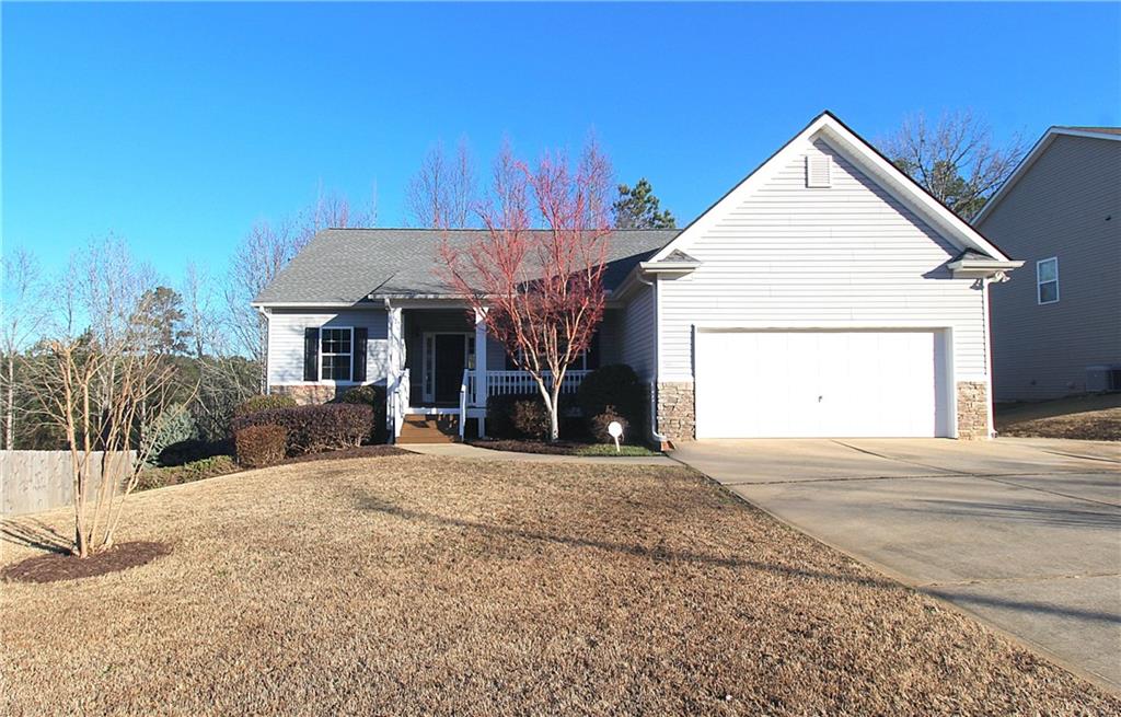 156 Alexandria Way Dallas, GA 30132 - Photo 1 of 1 a view of a house with a yard and potted plants
