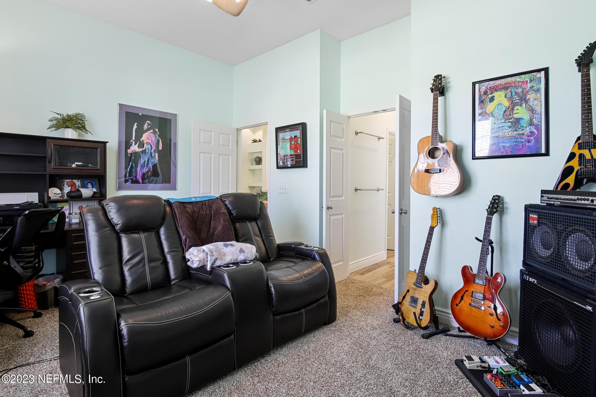 3926 Danforth Drive West Jacksonville, FL 32224 - Photo 18 of 35 a living room with furniture a flat screen tv and a view of bedroom
