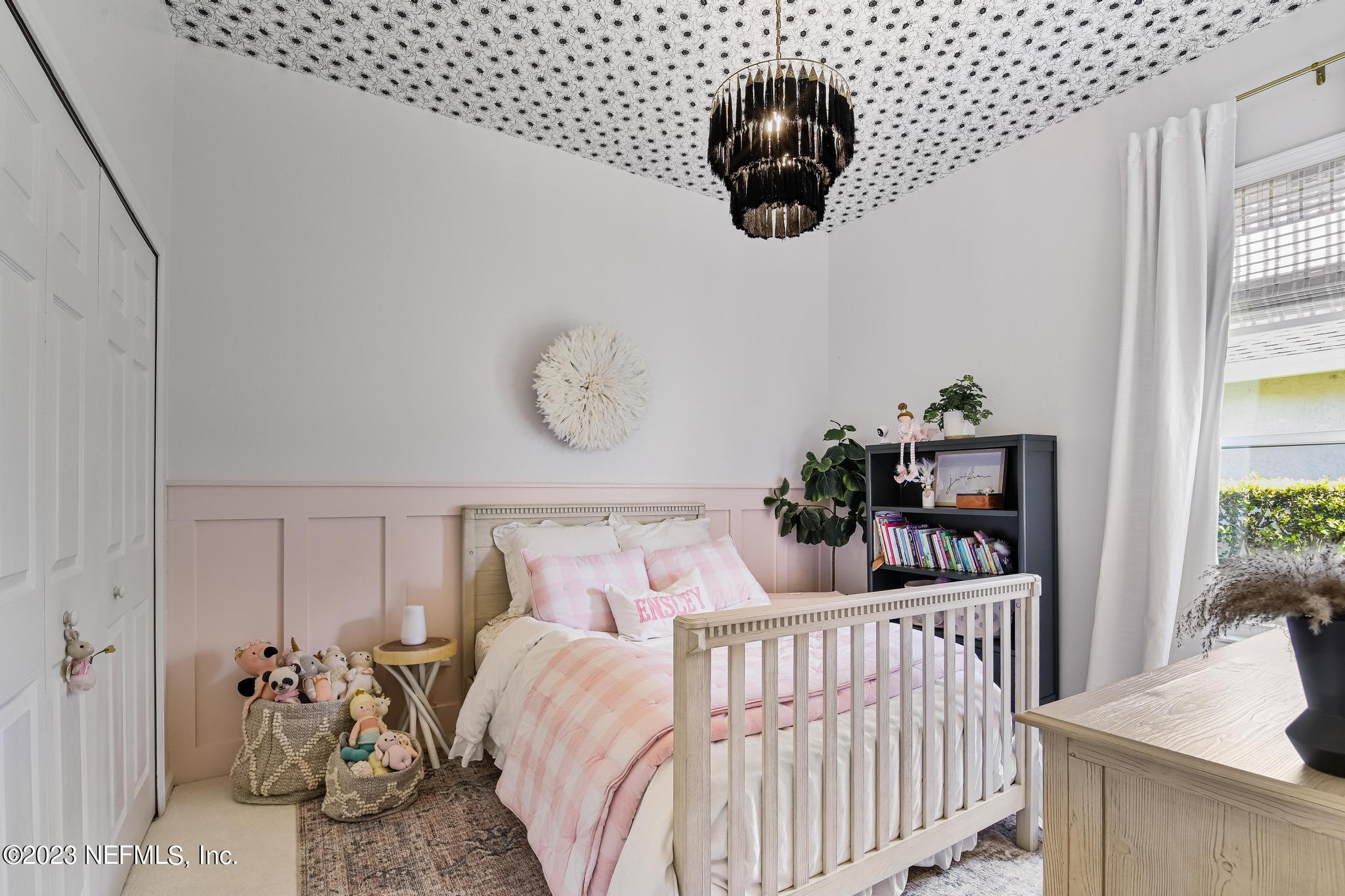 3926 Danforth Drive West Jacksonville, FL 32224 - Photo 19 of 35 a bedroom with furniture and a large window