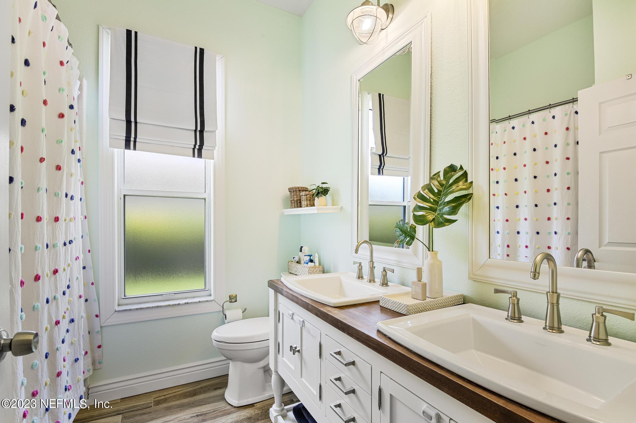 3926 Danforth Drive West Jacksonville, FL 32224 - Photo 20 of 35 a bathroom with a granite countertop sink toilet and shower