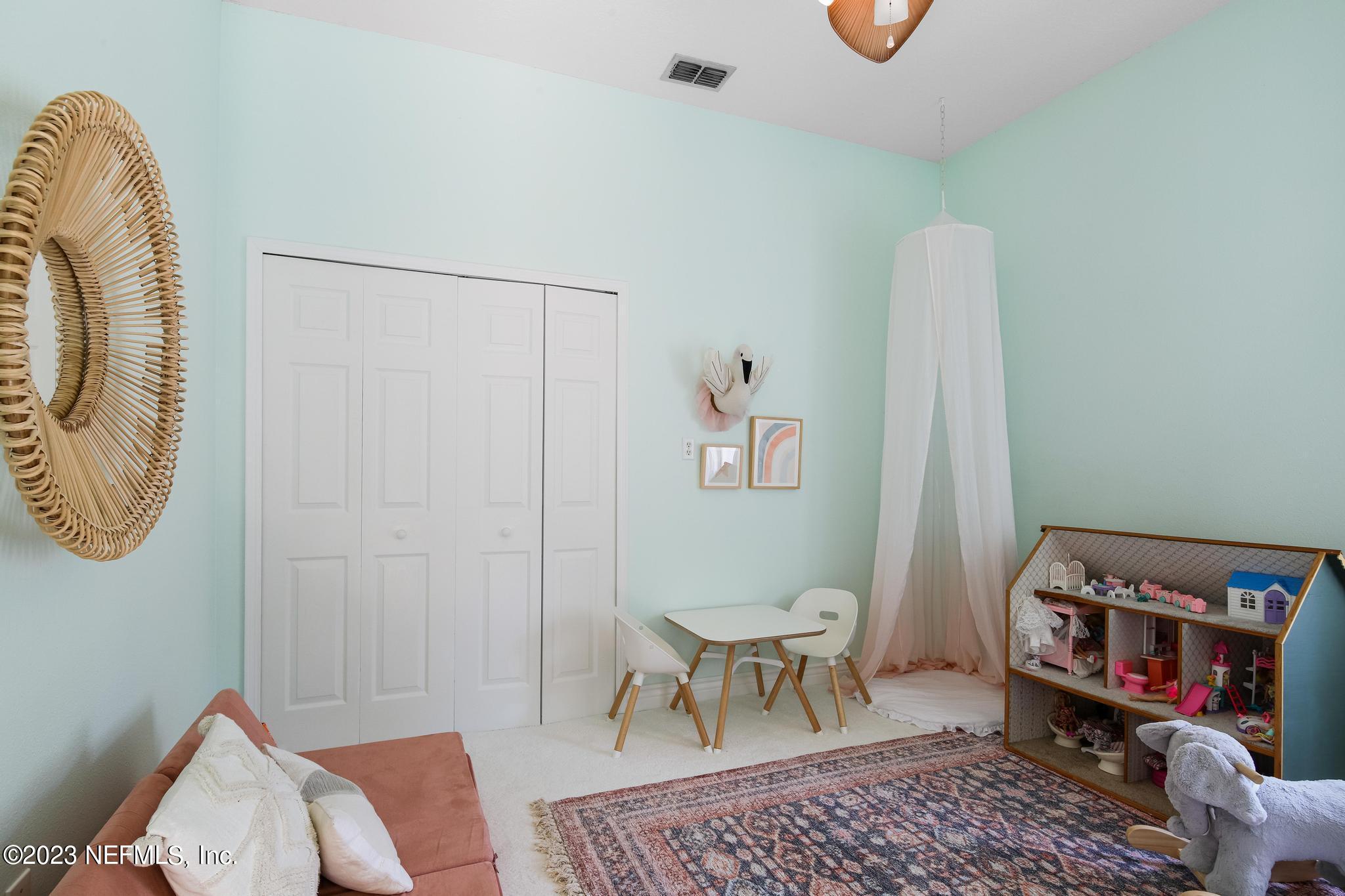 3926 Danforth Drive West Jacksonville, FL 32224 - Photo 22 of 35 a living room with furniture a rug and a table