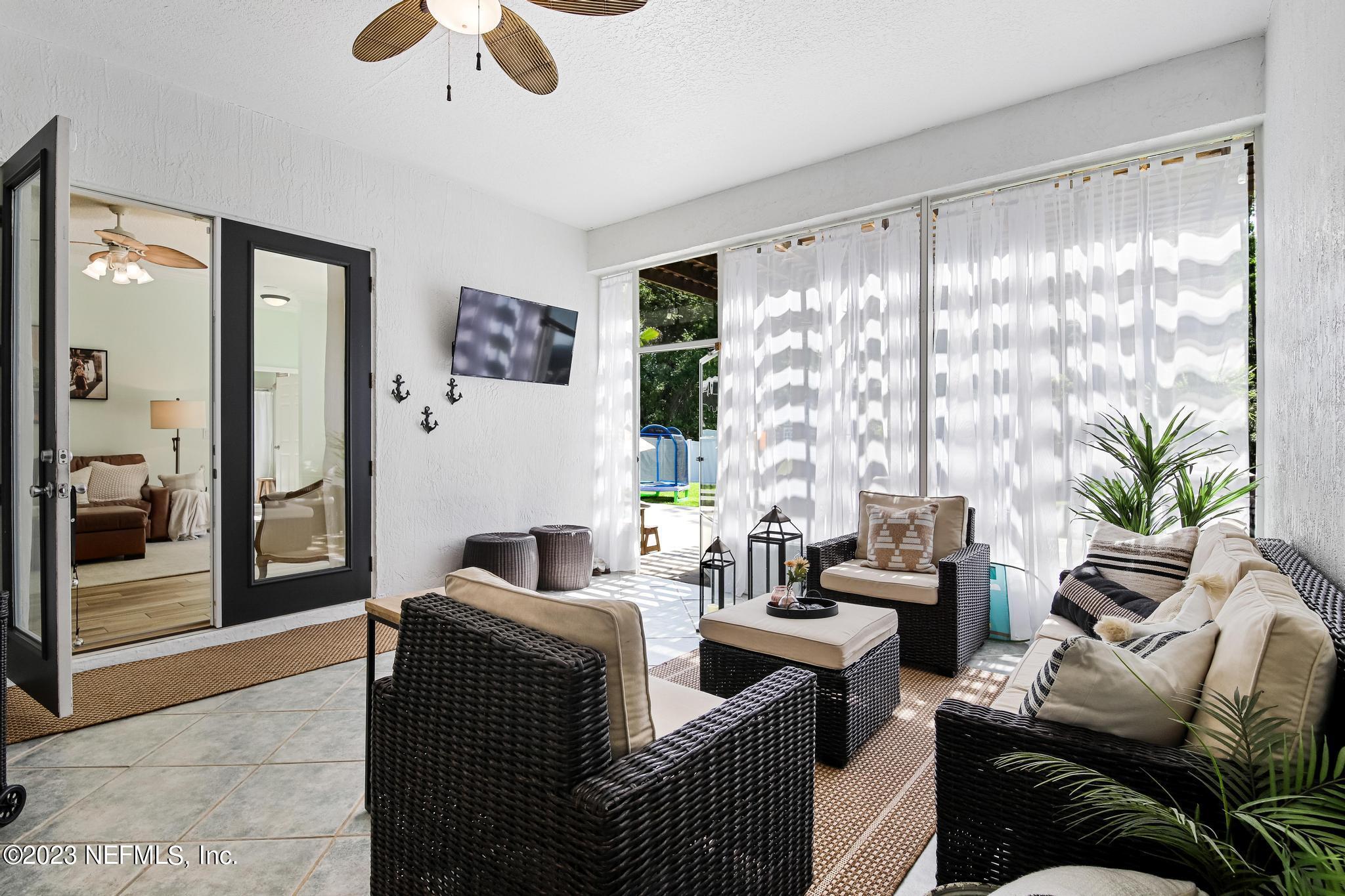 3926 Danforth Drive West Jacksonville, FL 32224 - Photo 27 of 35 a living room with furniture and a large window