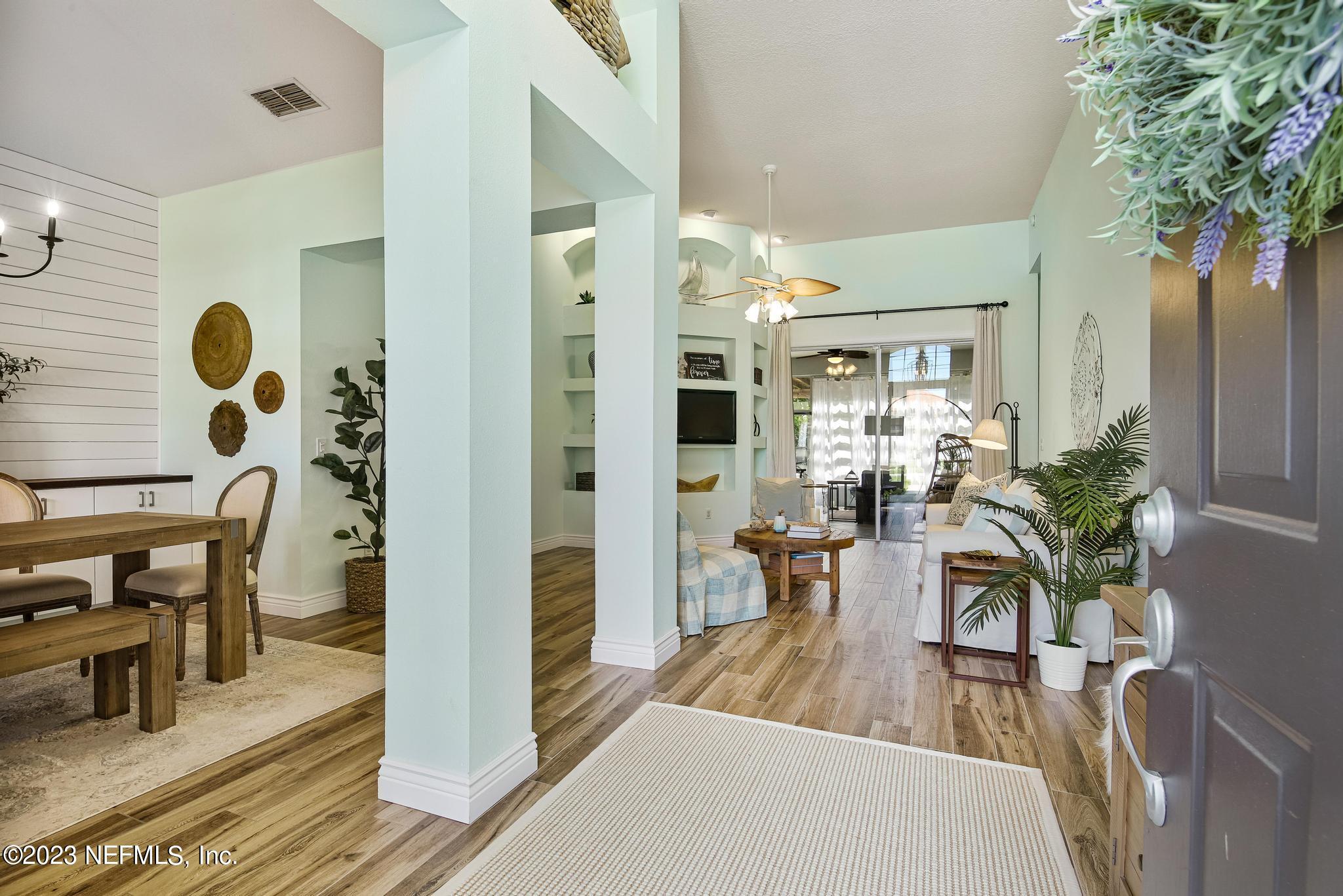 3926 Danforth Drive West Jacksonville, FL 32224 - Photo 3 of 35 a view of a dining room with furniture and wooden floor