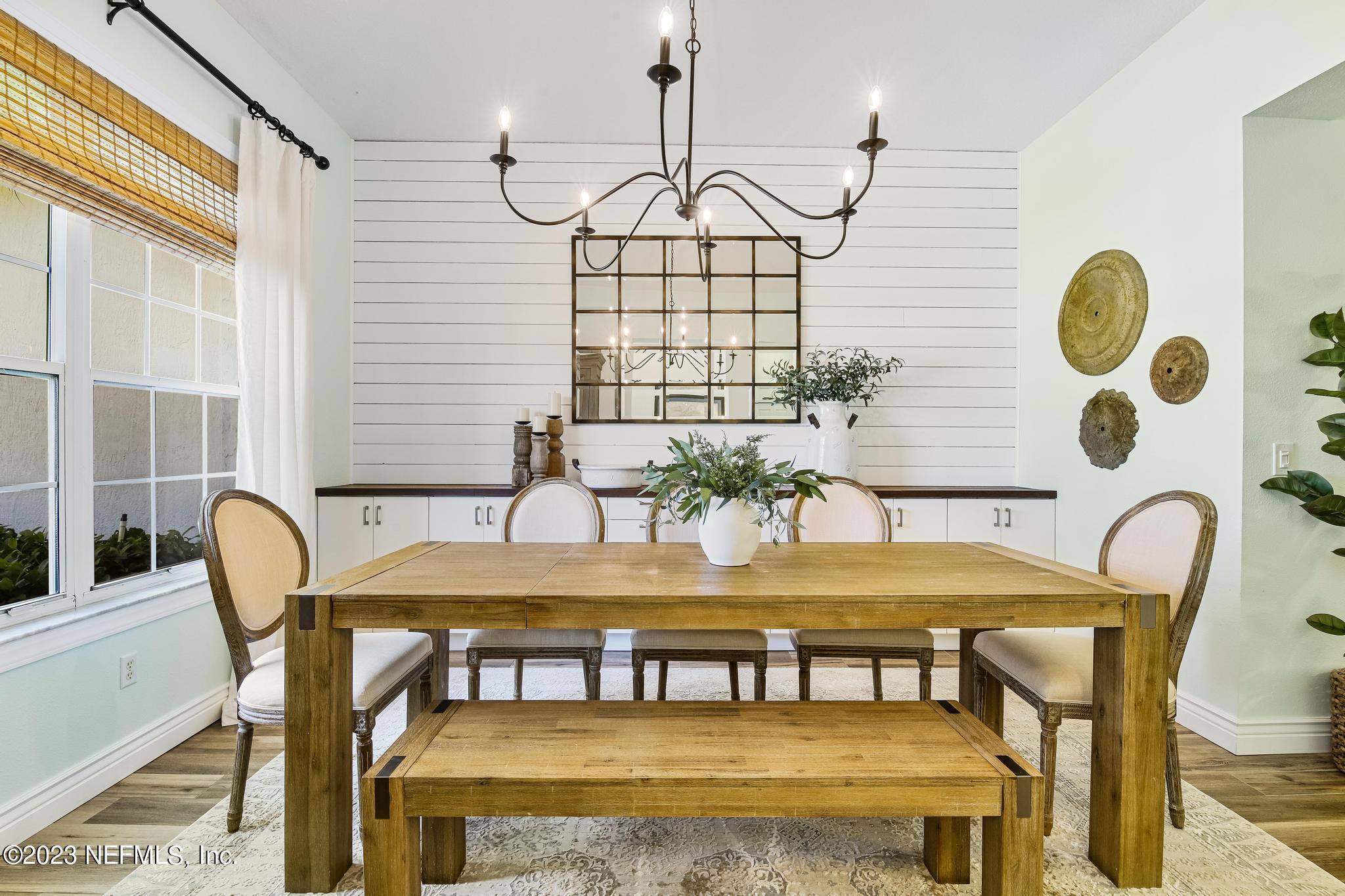 3926 Danforth Drive West Jacksonville, FL 32224 - Photo 4 of 35 a view of a dining room with furniture and wooden floor