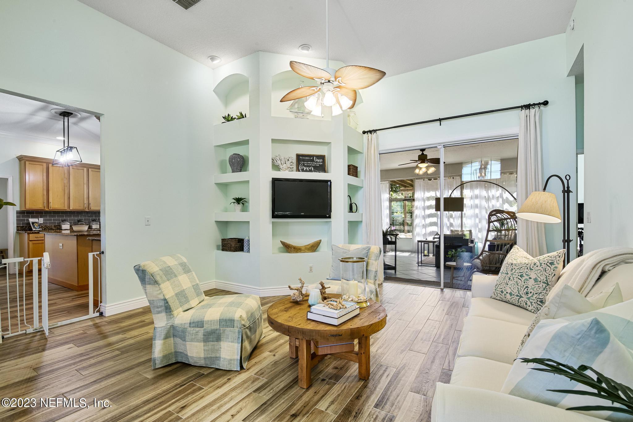 3926 Danforth Drive West Jacksonville, FL 32224 - Photo 6 of 35 a living room with furniture and a flat screen tv