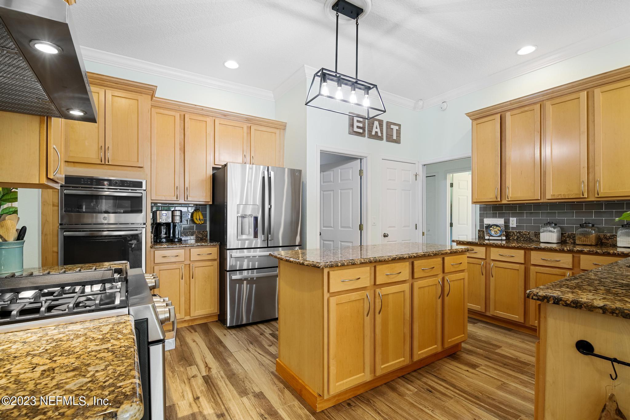 3926 Danforth Drive West Jacksonville, FL 32224 - Photo 7 of 35 a kitchen with stainless steel appliances a refrigerator sink and cabinets