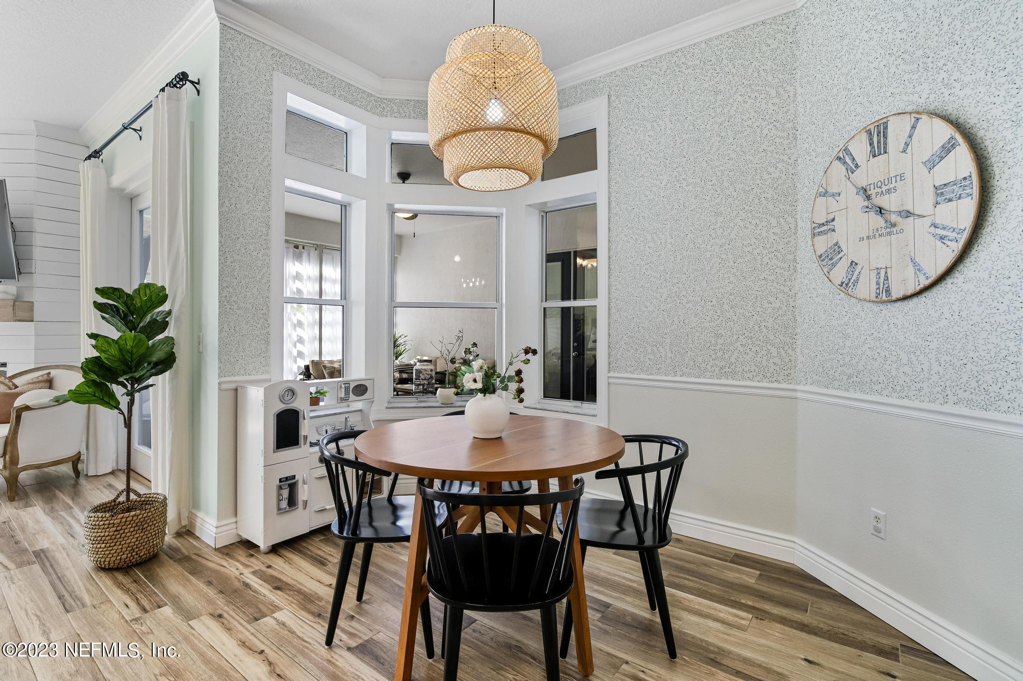 3926 Danforth Drive West Jacksonville, FL 32224 - Photo 9 of 35 a view of a dining room with furniture and wooden floor