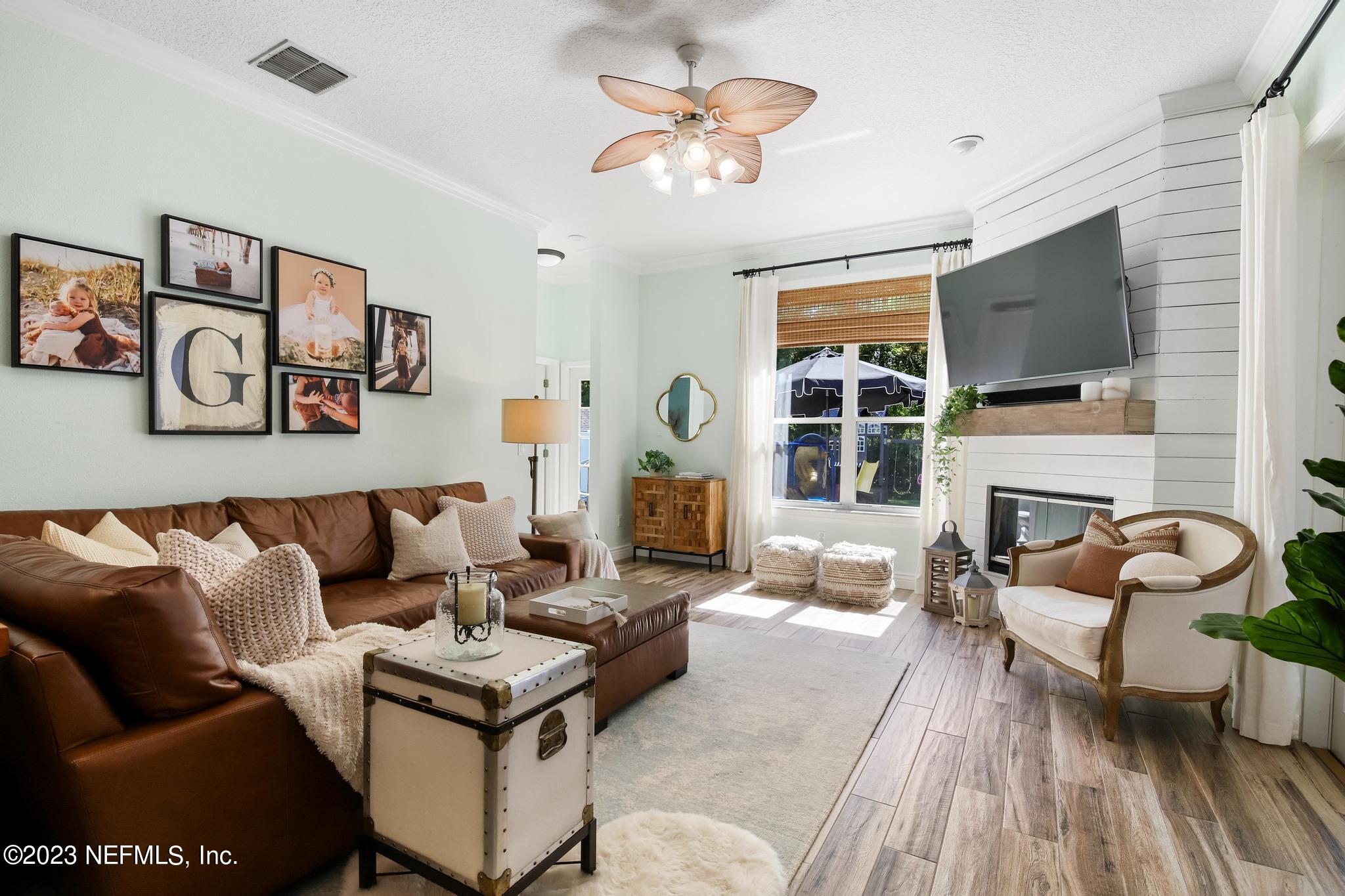 3926 Danforth Drive West Jacksonville, FL 32224 - Photo 10 of 35 a living room with furniture and a fireplace