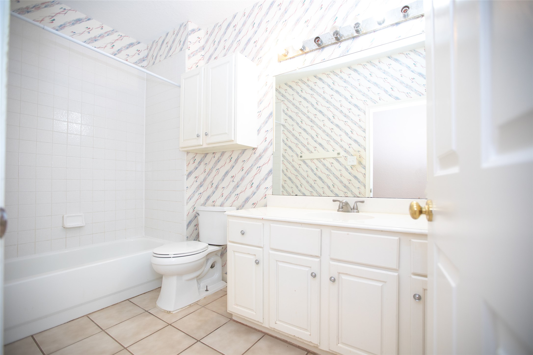 8615 Mile Run Road Humble, TX 77346 - Photo 13 of 16 a bathroom with a sink toilet a mirror and shower