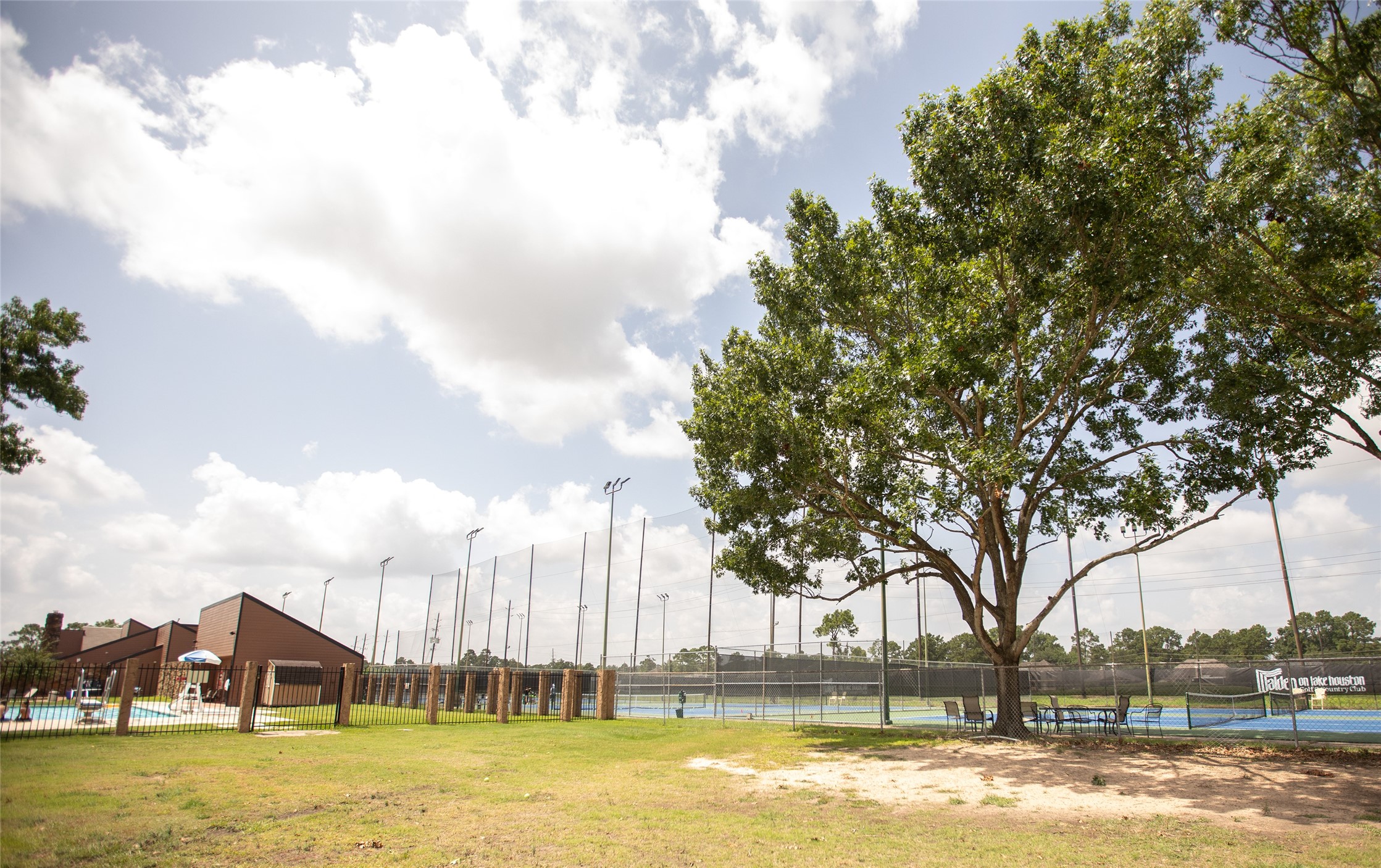 8615 Mile Run Road Humble, TX 77346 - Photo 16 of 16 a front view of a house with a big yard and large trees