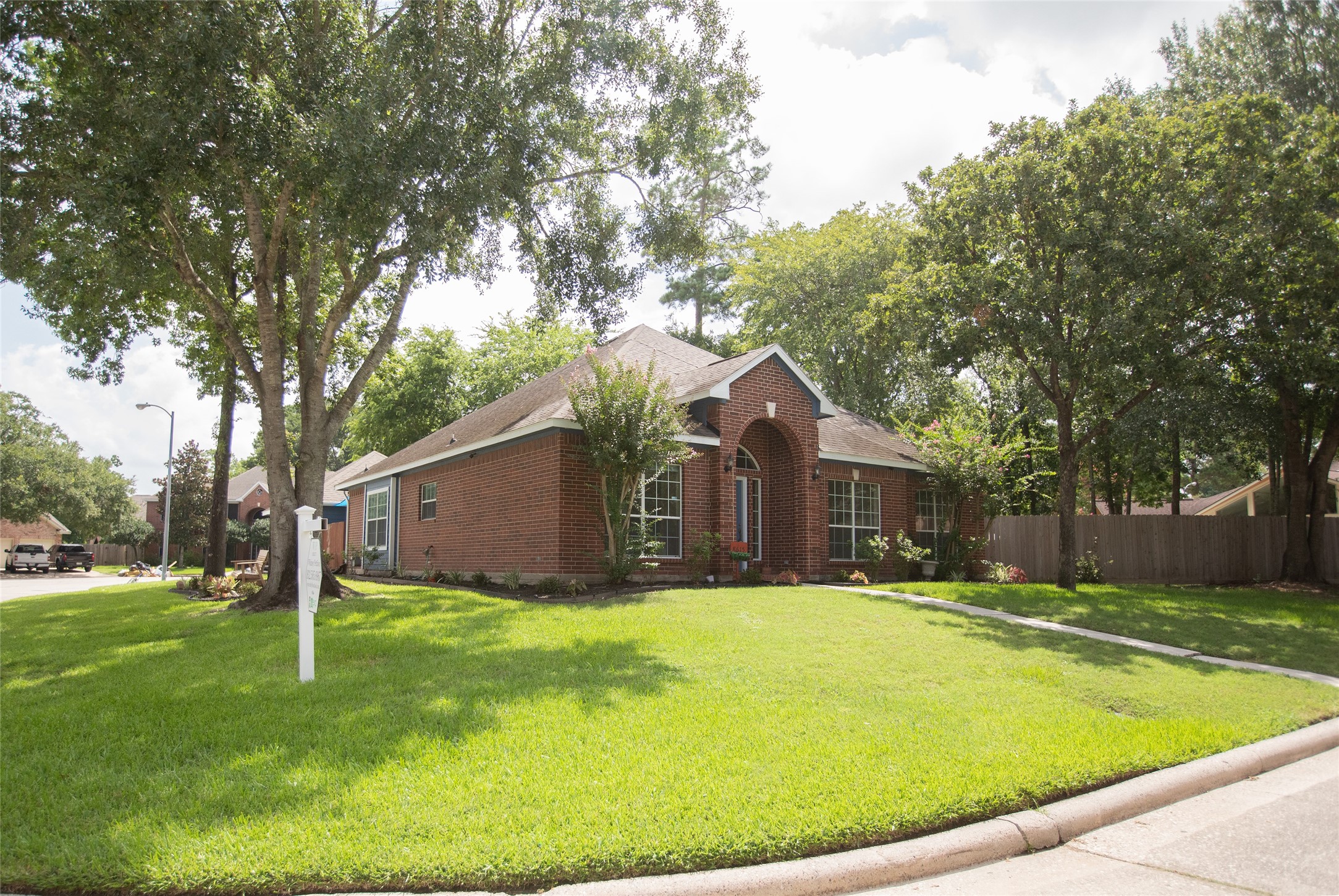 8615 Mile Run Road Humble, TX 77346 - Photo 3 of 16 a backyard of a house with yard and green space