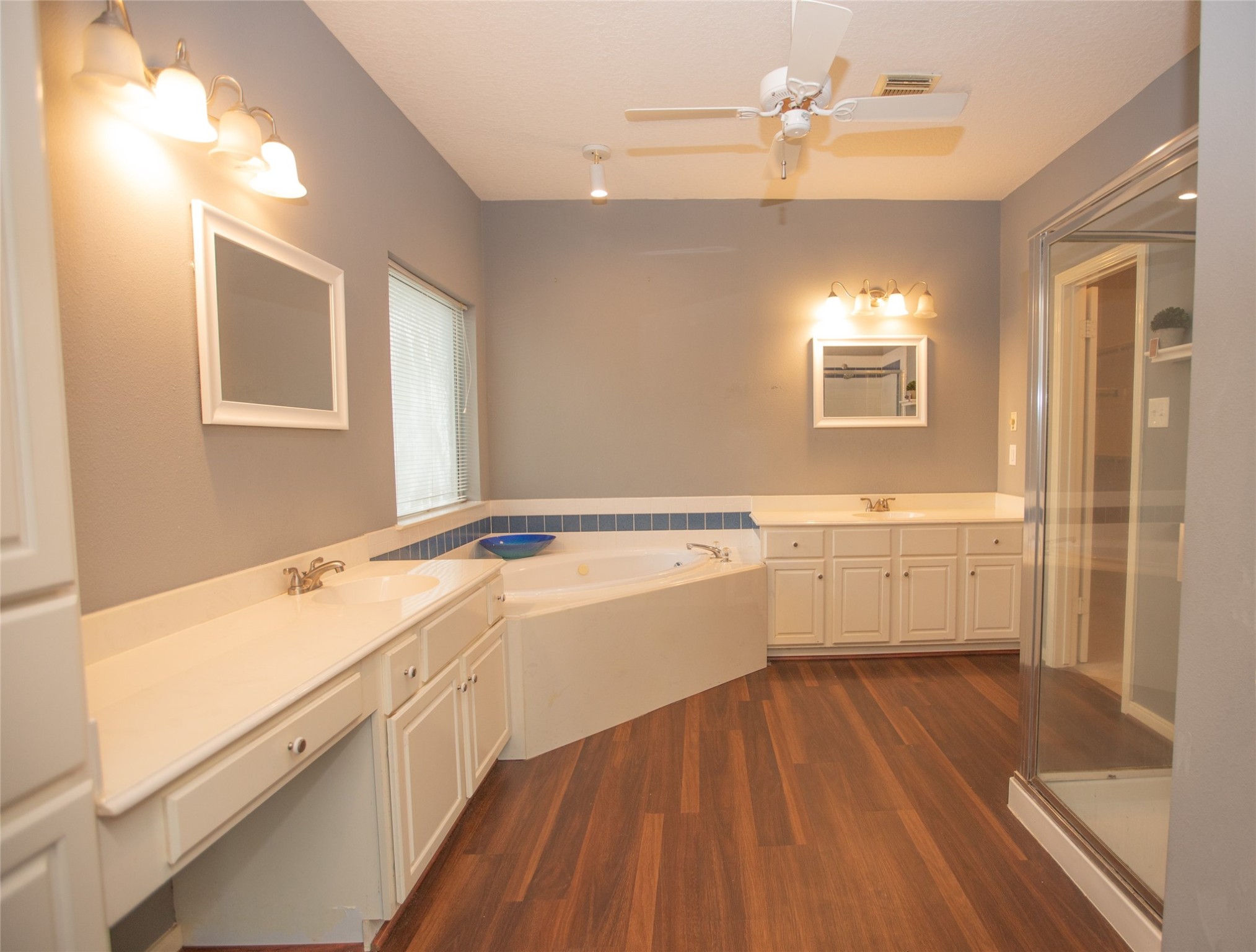 8615 Mile Run Road Humble, TX 77346 - Photo 8 of 16 a bathroom with a sink a mirror and a bathtub
