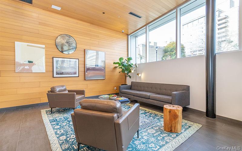 1 Dekalb Avenue, Unit PH10 White Plains, NY 10605 - Photo 13 of 18 a living room with furniture and a large window
