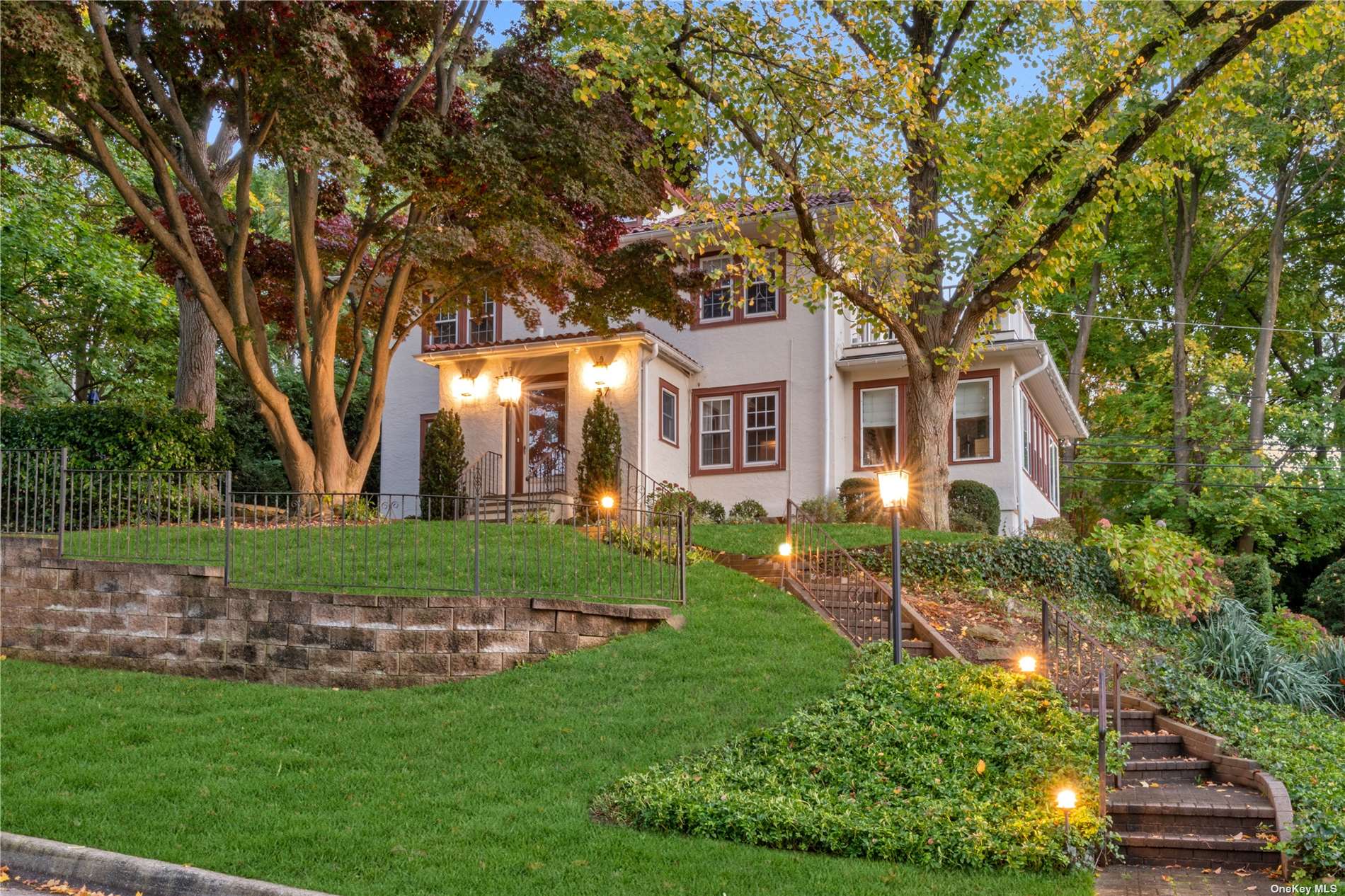 37 Crescent Road Port Washington, NY 11050 - Photo 1 of 1 a front view of a house with a garden