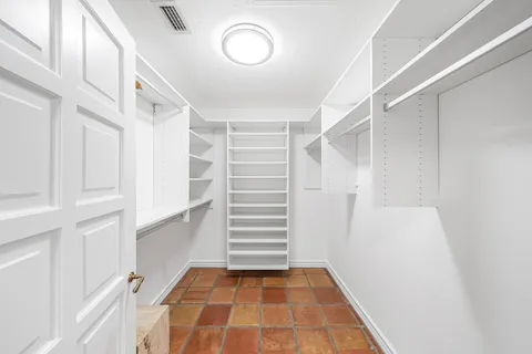 a stove top oven sitting inside of a kitchen