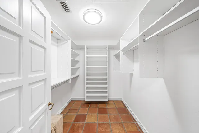 a stove top oven sitting inside of a kitchen