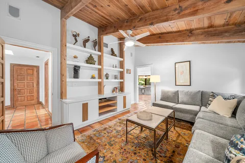 a spacious bathroom with a granite countertop sink a mirror and a