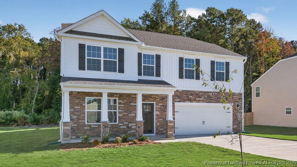 3034 Bayview Drive Vass, NC 28394 - Photo 3 of 47 a front view of a house with a yard