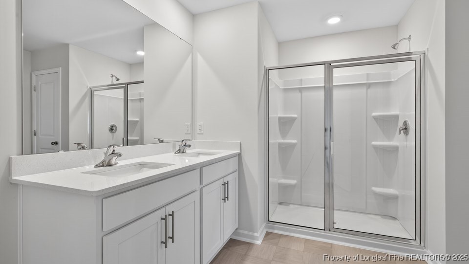 3034 Bayview Drive Vass, NC 28394 - Photo 33 of 47 a bathroom with a shower sink and mirror