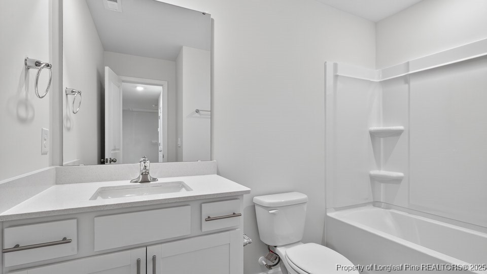 3034 Bayview Drive Vass, NC 28394 - Photo 35 of 47 a bathroom with a sink toilet vanity and bathtub