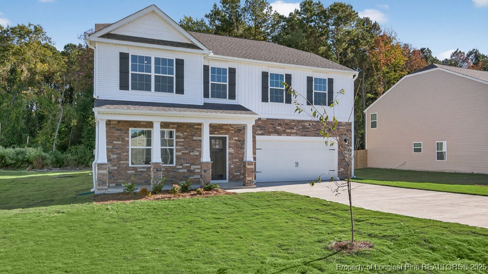 3034 Bayview Drive Vass, NC 28394 - Photo 4 of 47 a front view of a house with a yard