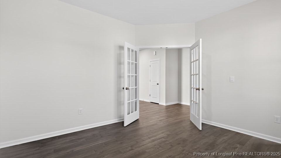 3034 Bayview Drive Vass, NC 28394 - Photo 8 of 47 a view of an empty room with wooden floor