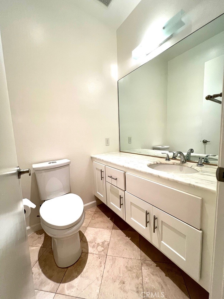 700 South Lake Avenue, Unit 111 Pasadena, CA 91106 - Photo 20 of 40 a bathroom with a toilet sink and mirror