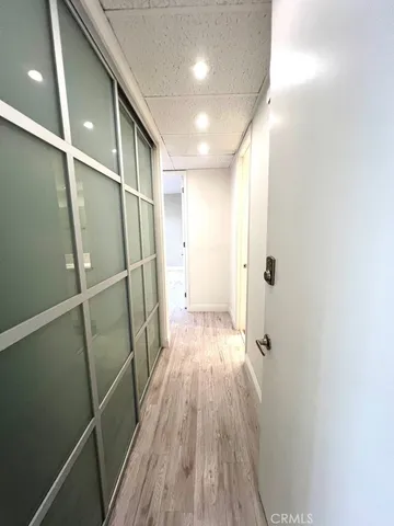 a spacious bathroom with double vanity and a mirror