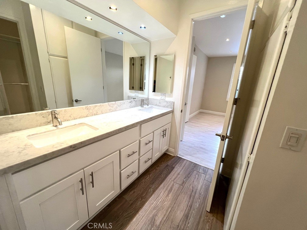 700 South Lake Avenue, Unit 111 Pasadena, CA 91106 - Photo 23 of 40 a spacious bathroom with double vanity and a mirror