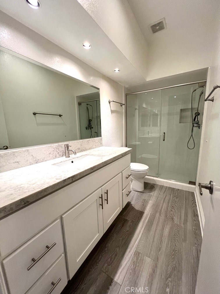 700 South Lake Avenue, Unit 111 Pasadena, CA 91106 - Photo 24 of 40 a spacious bathroom with a double vanity sink toilet mirror and shower