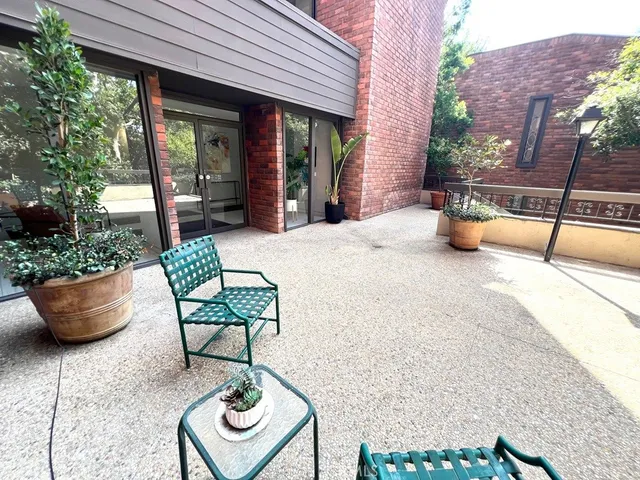 a view of an outdoor sitting area with a couch