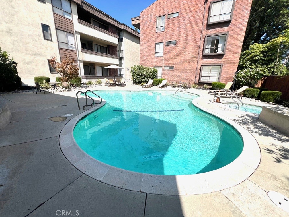 700 South Lake Avenue, Unit 111 Pasadena, CA 91106 - Photo 37 of 40 a view of a swimming pool with a lounge chairs