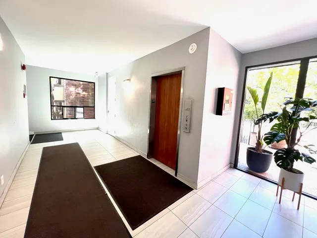 a view of a living room with furniture and a window