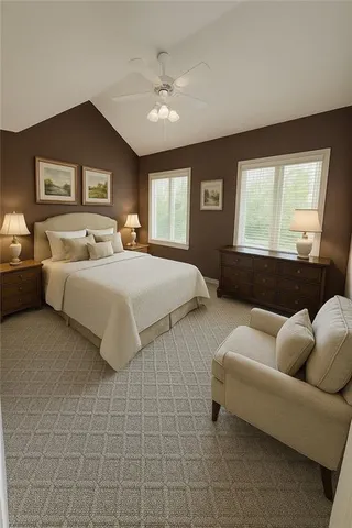 a bedroom with a bed couch and window