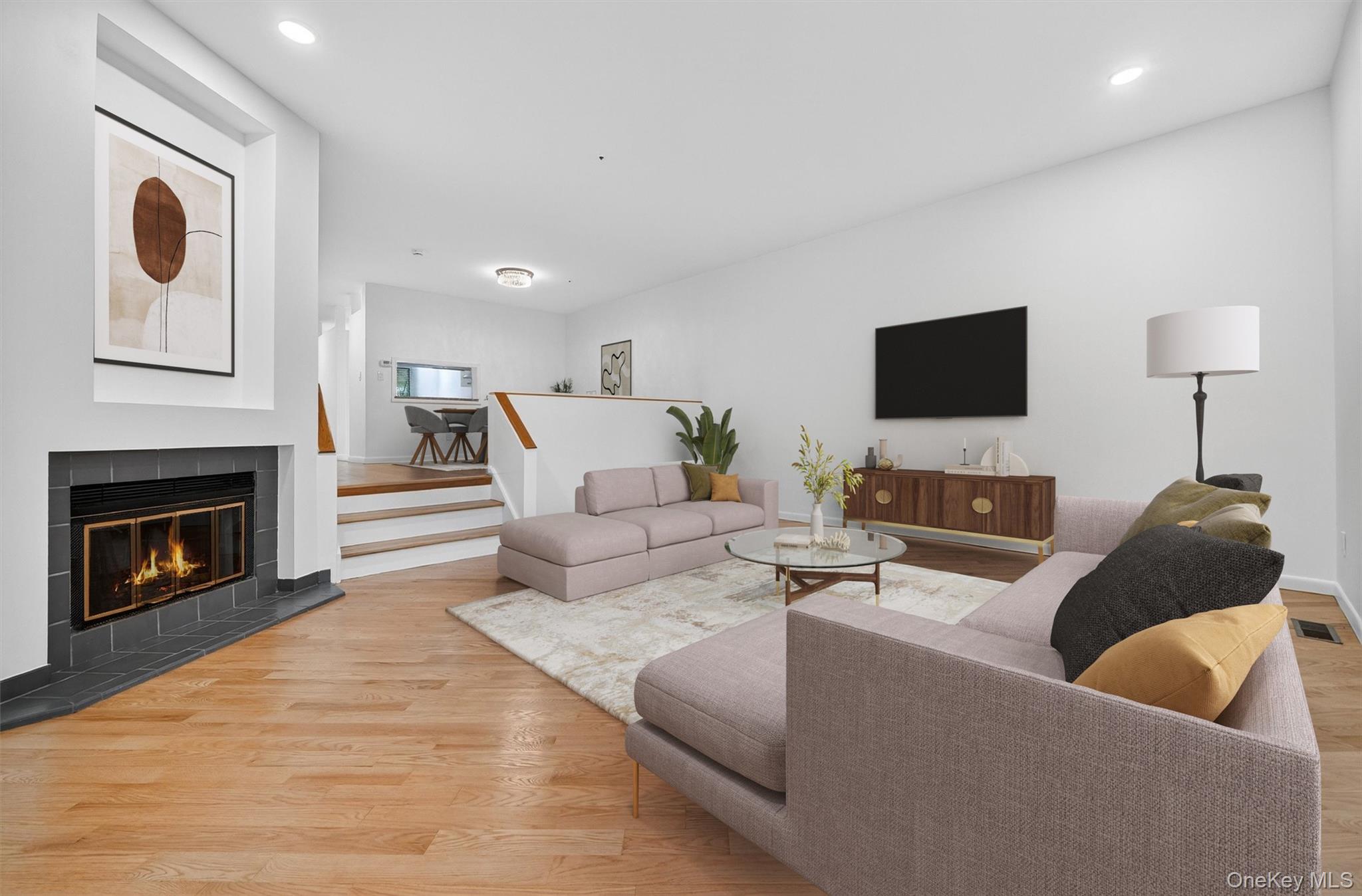 57 Boulder Ridge Road Scarsdale, NY 10583 - Photo 11 of 49 a living room with furniture and a fireplace