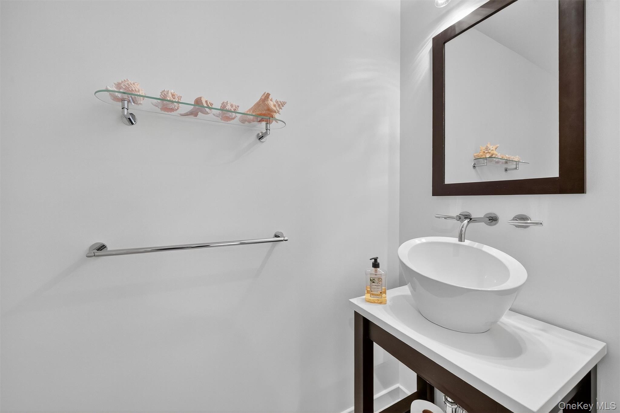 57 Boulder Ridge Road Scarsdale, NY 10583 - Photo 12 of 49 a bathroom with a sink and a mirror