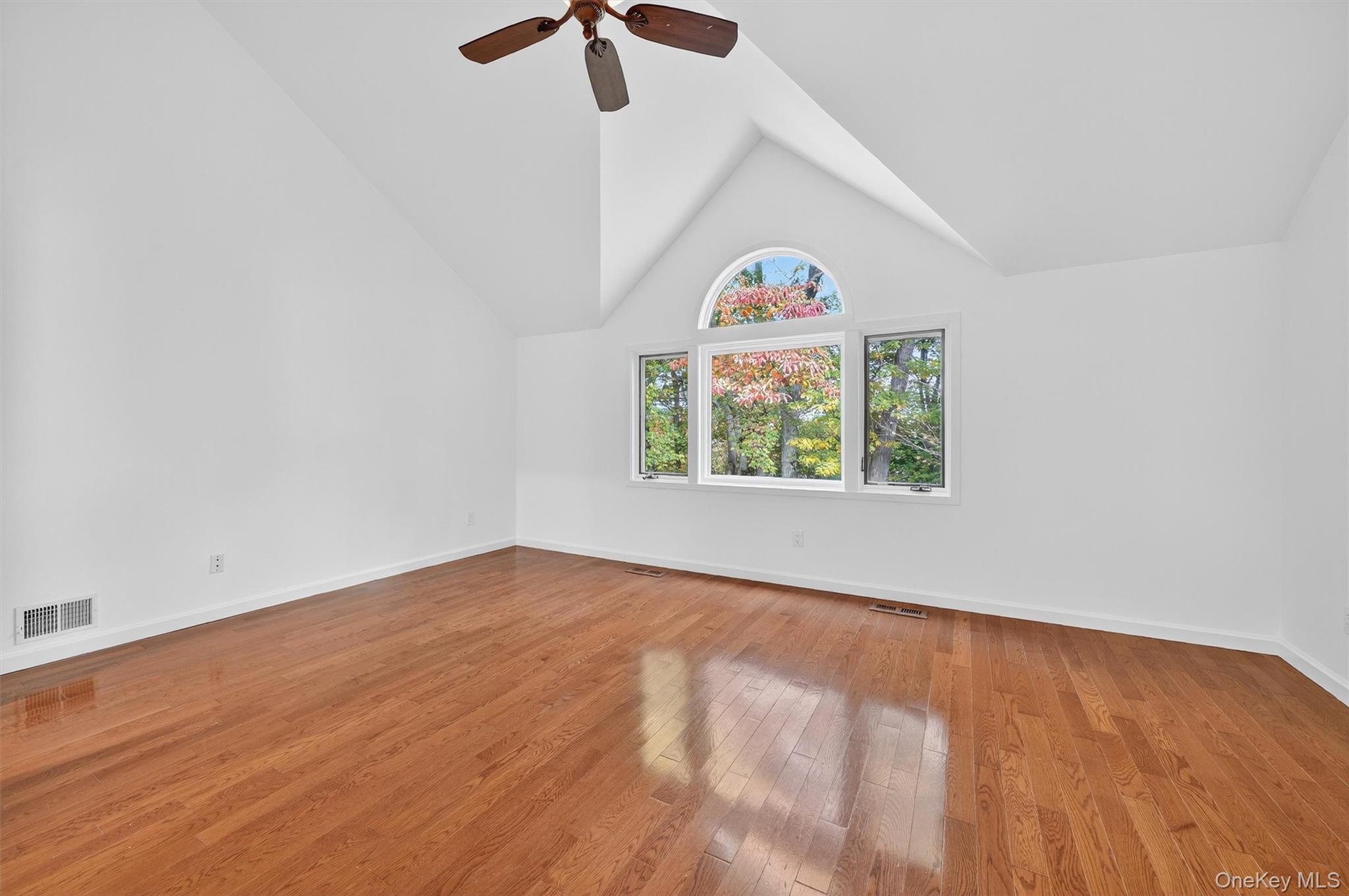57 Boulder Ridge Road Scarsdale, NY 10583 - Photo 13 of 49 an empty room with window and ceiling fan