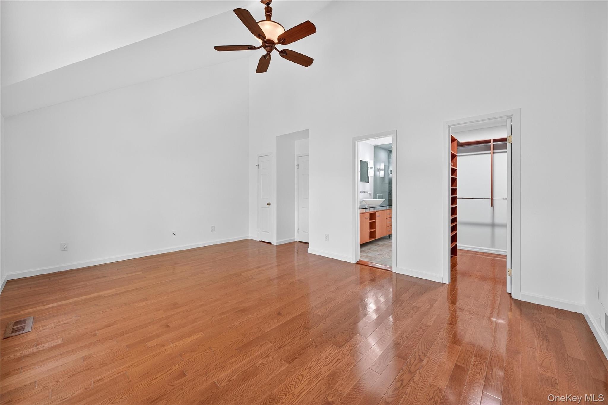 57 Boulder Ridge Road Scarsdale, NY 10583 - Photo 15 of 49 a view of empty room with wooden floor and ceiling fan