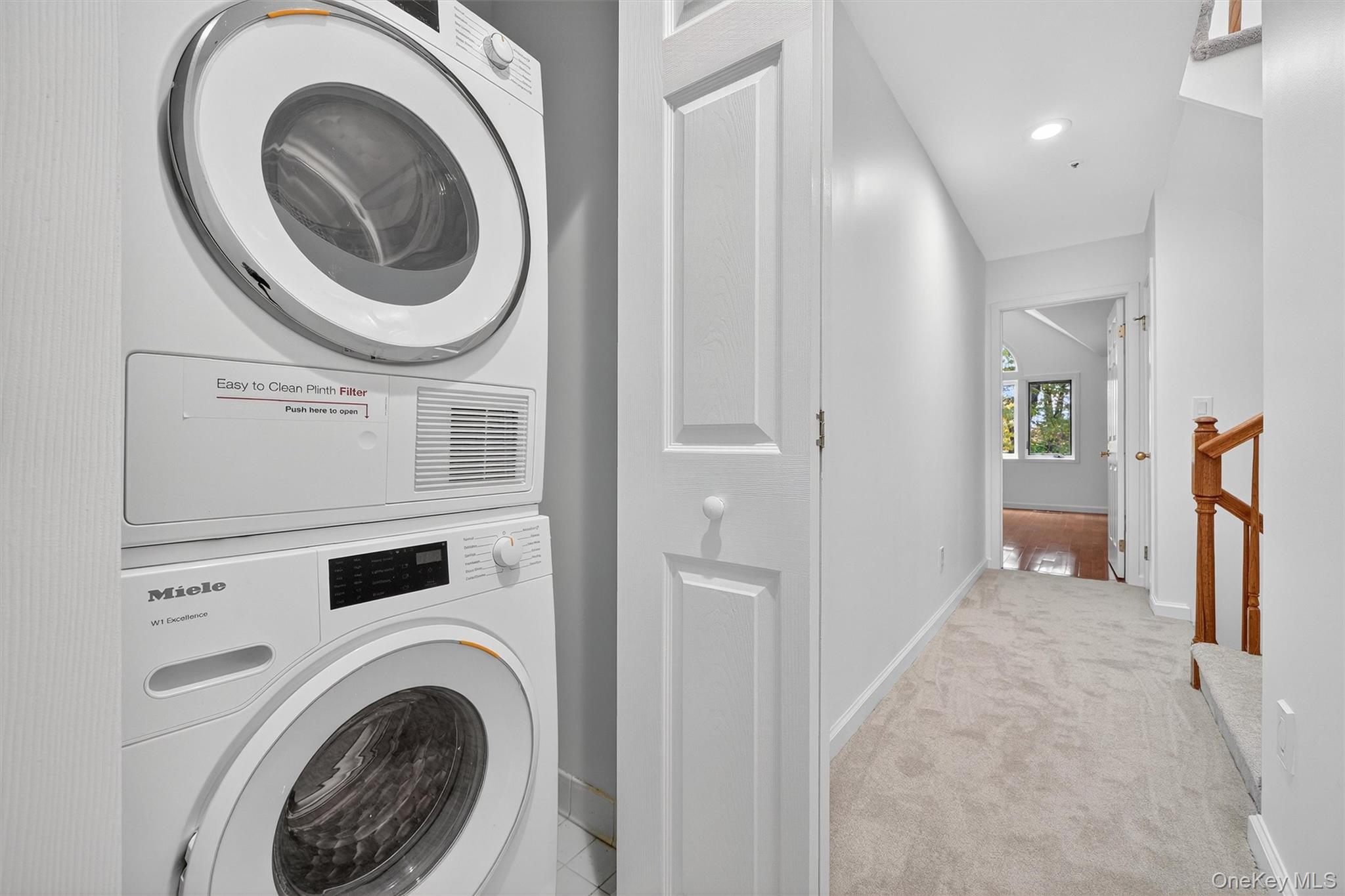 57 Boulder Ridge Road Scarsdale, NY 10583 - Photo 20 of 49 a view of a hallway with washer and dryer