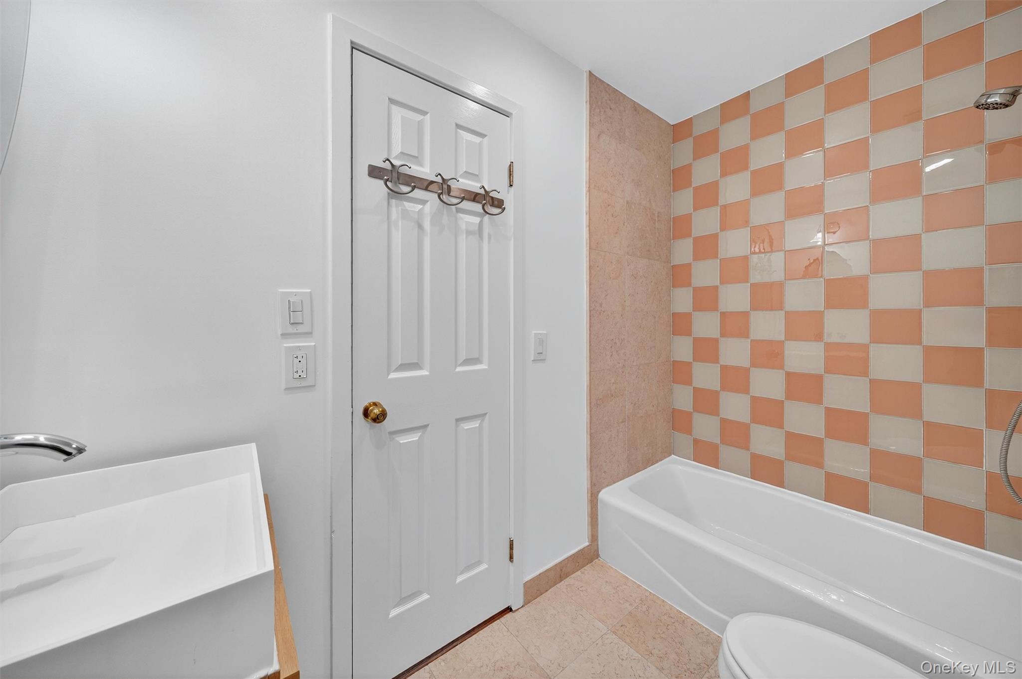 57 Boulder Ridge Road Scarsdale, NY 10583 - Photo 23 of 49 a bathroom with a bathtub and a shower