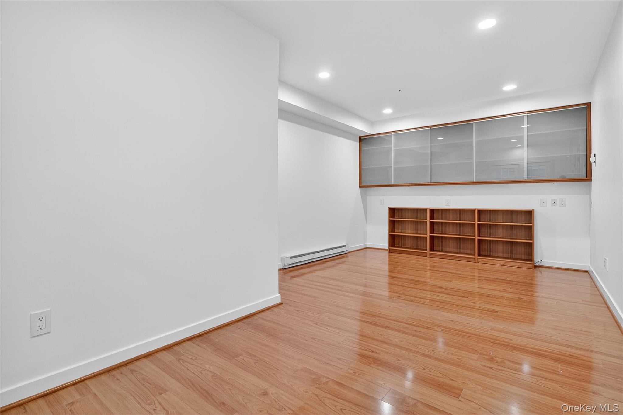 57 Boulder Ridge Road Scarsdale, NY 10583 - Photo 26 of 49 a view of empty room with wooden floor