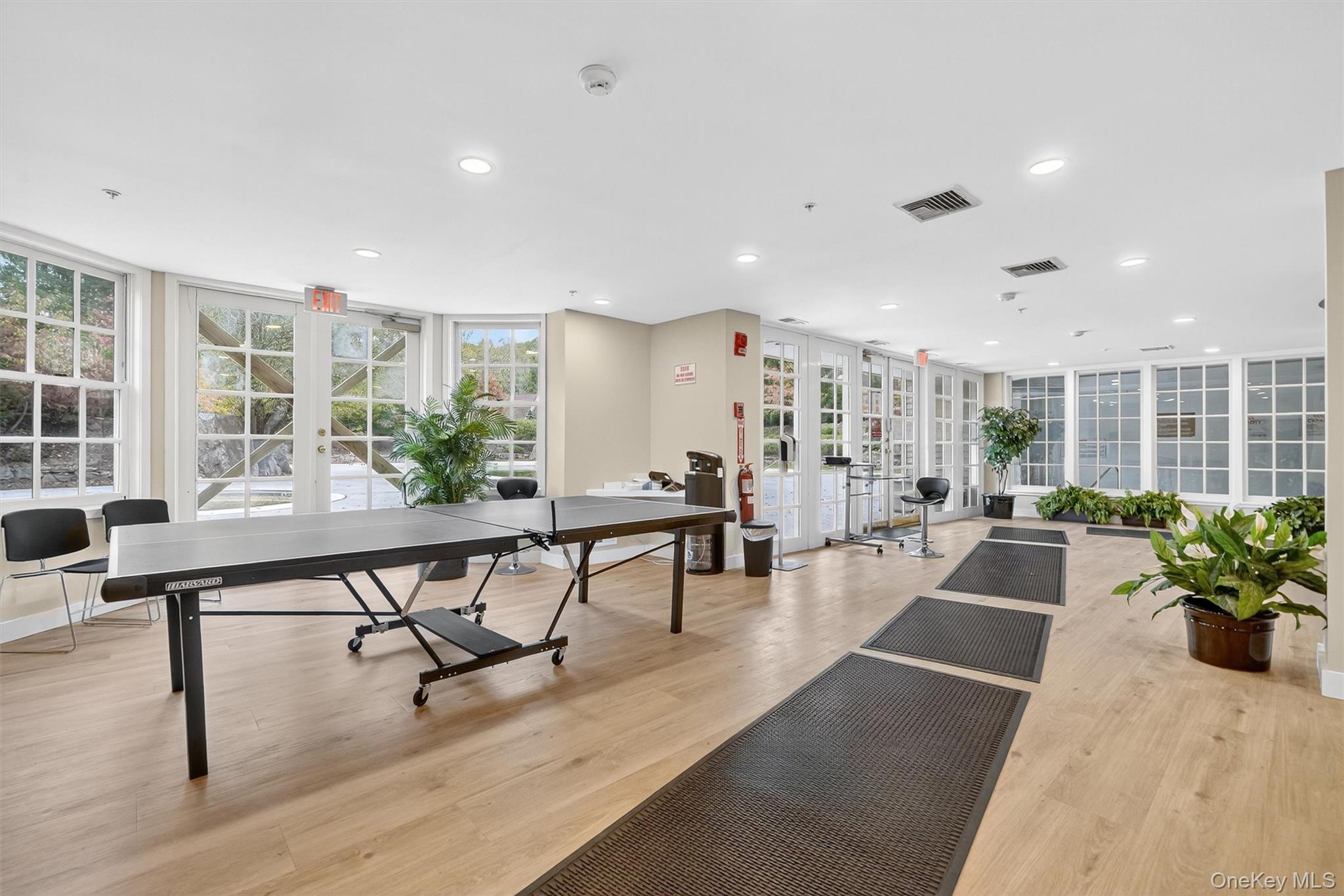 57 Boulder Ridge Road Scarsdale, NY 10583 - Photo 45 of 49 a living room with furniture and a table