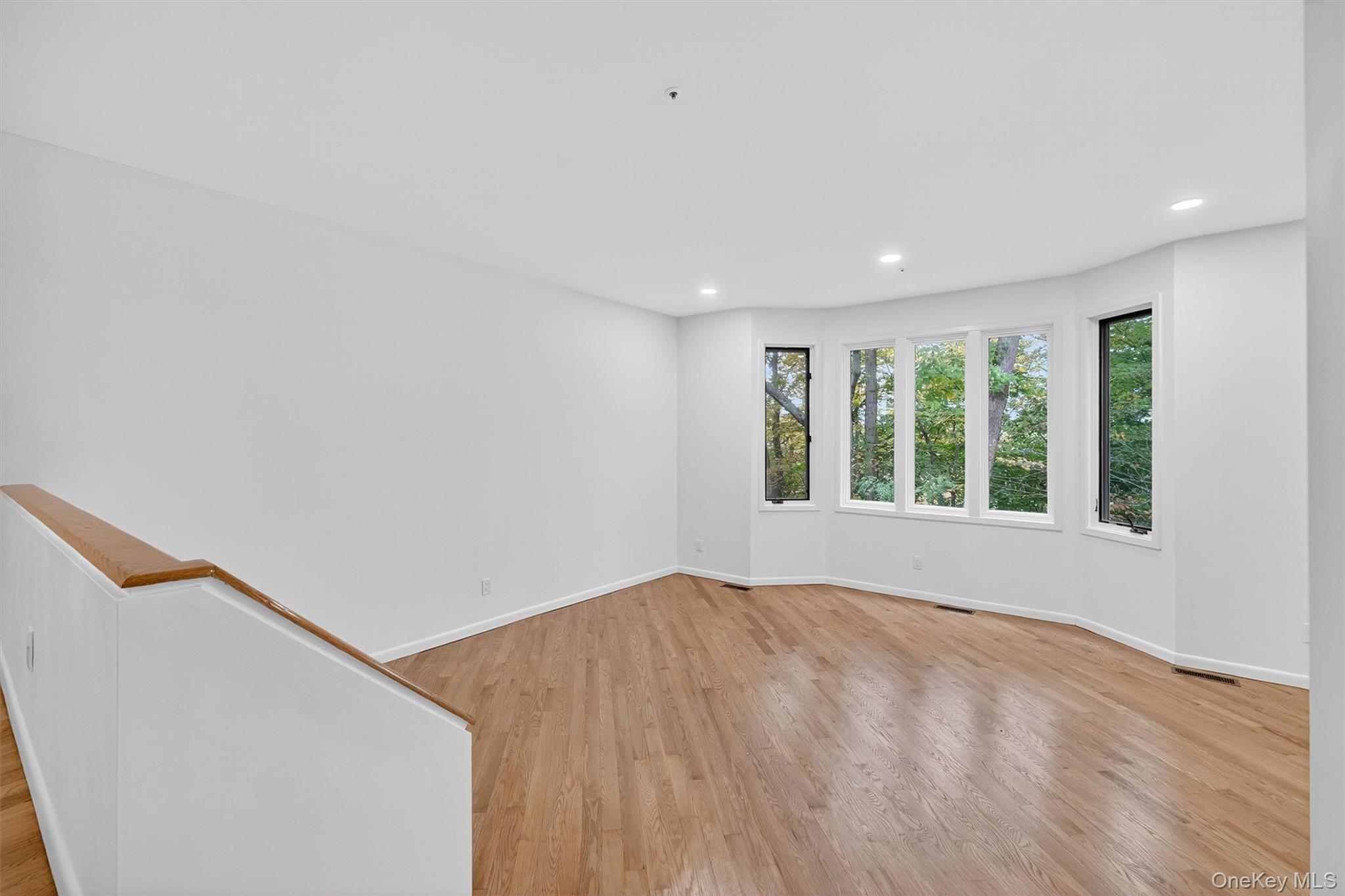 57 Boulder Ridge Road Scarsdale, NY 10583 - Photo 9 of 49 a view of an empty room with a window
