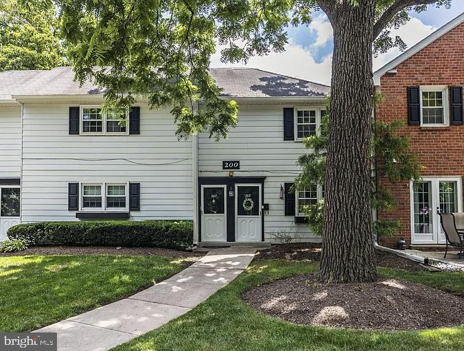207 Yardley Commons Yardley, PA 19067 - Photo 1 of 11 a front view of a house with garden