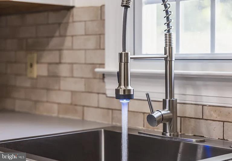 207 Yardley Commons Yardley, PA 19067 - Photo 5 of 11 a kitchen with a sink and glass window