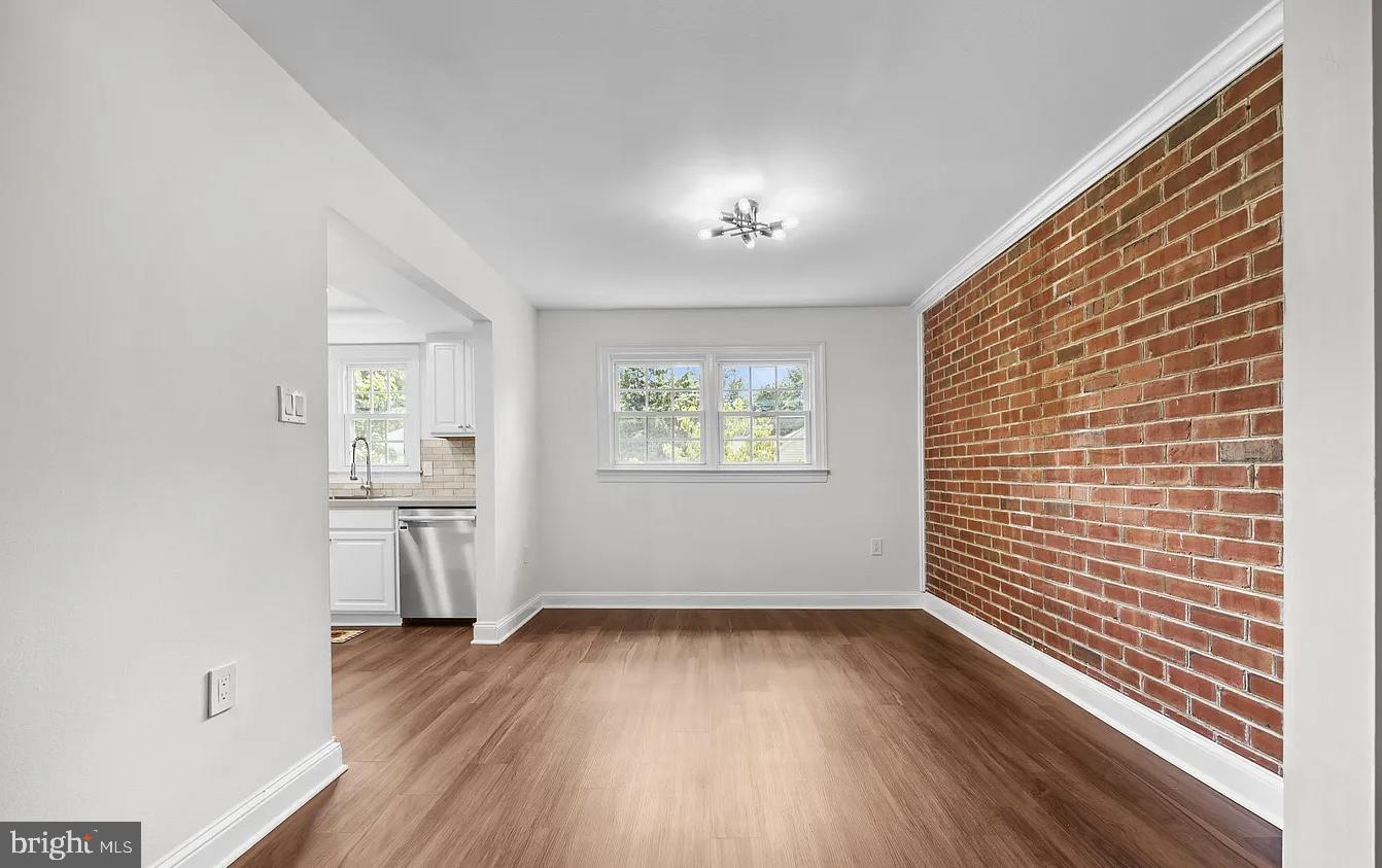 207 Yardley Commons Yardley, PA 19067 - Photo 6 of 11 a view of empty room with wooden floor and fan