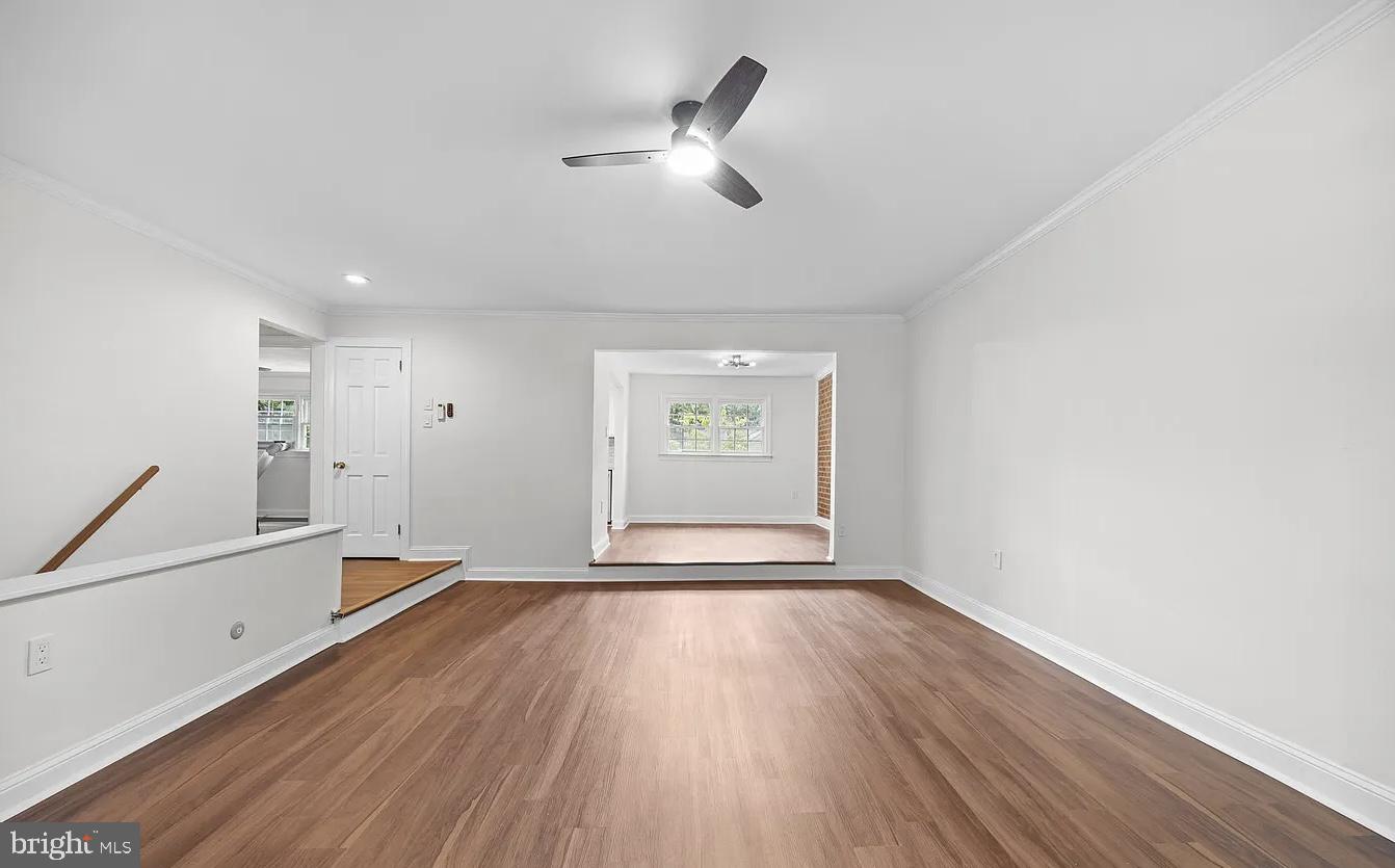 207 Yardley Commons Yardley, PA 19067 - Photo 8 of 11 a view of empty room with wooden floor and fan