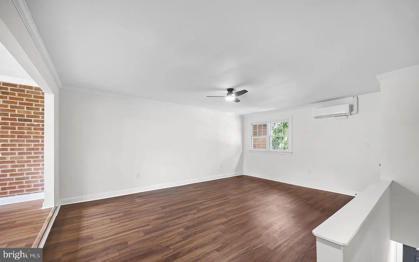 207 Yardley Commons Yardley, PA 19067 - Photo 9 of 11 an empty room with wooden floor and windows