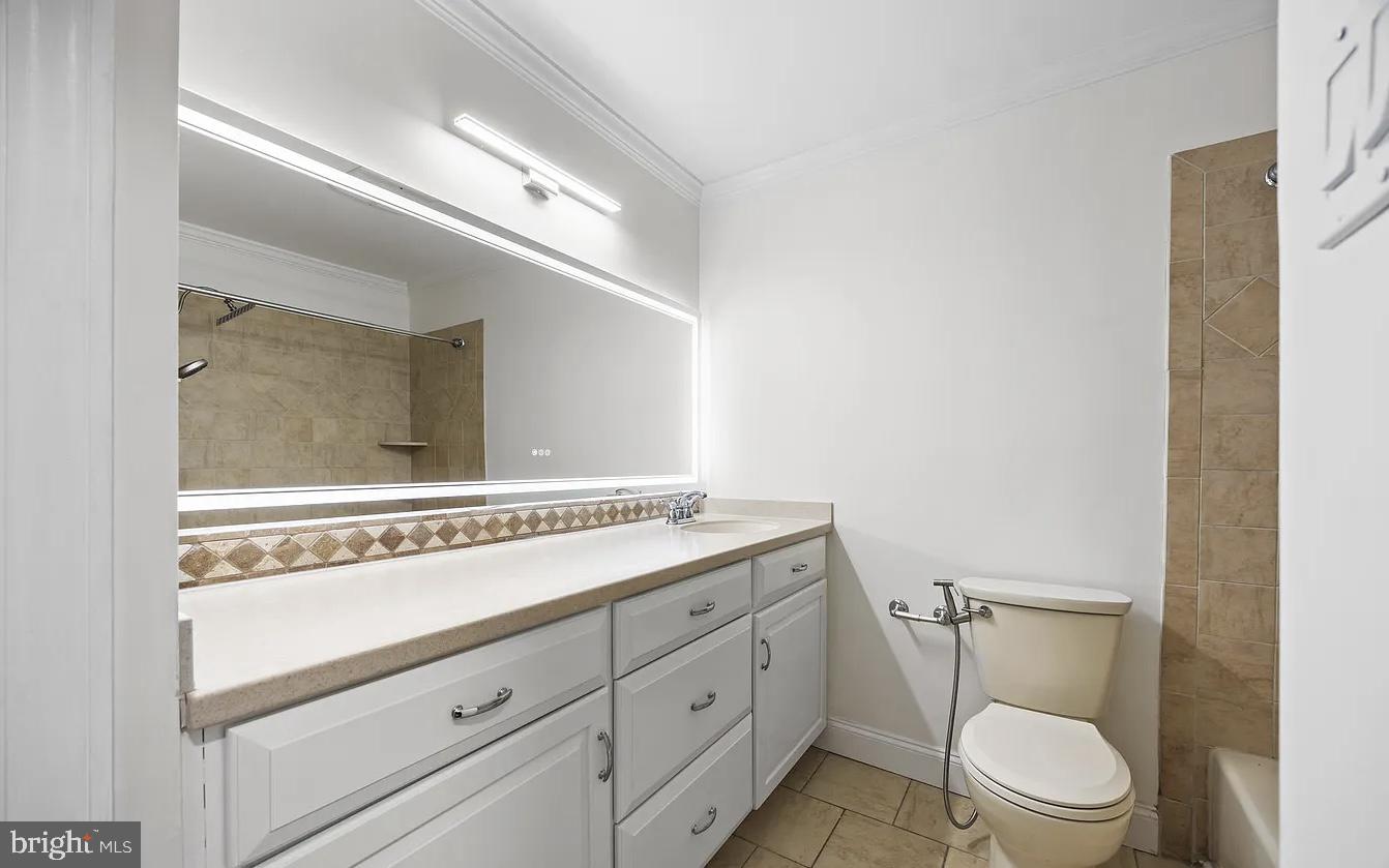 207 Yardley Commons Yardley, PA 19067 - Photo 10 of 11 a bathroom with a toilet a sink and mirror